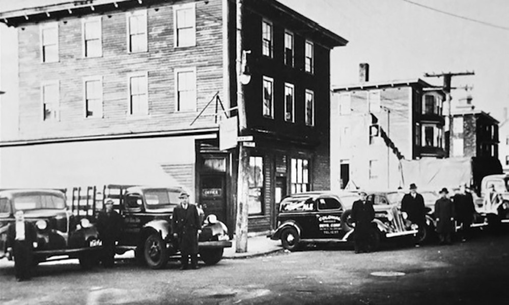 Old Photo of Men Standing By Their Cars