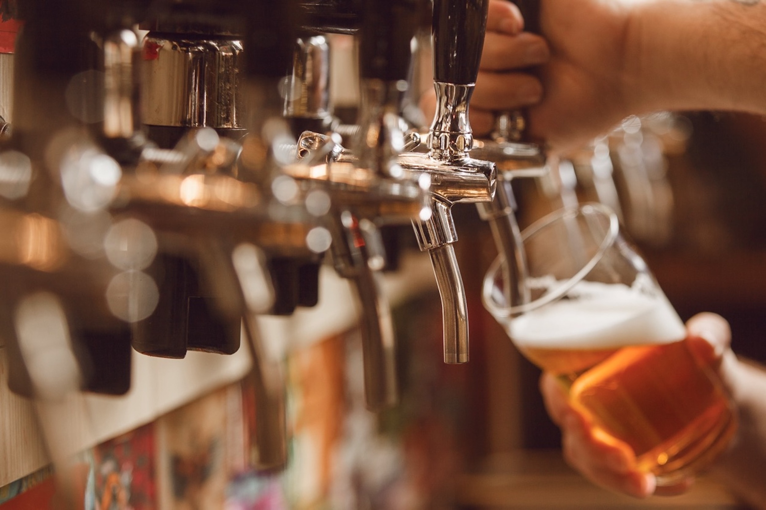 Beer Being Poured From a Tap