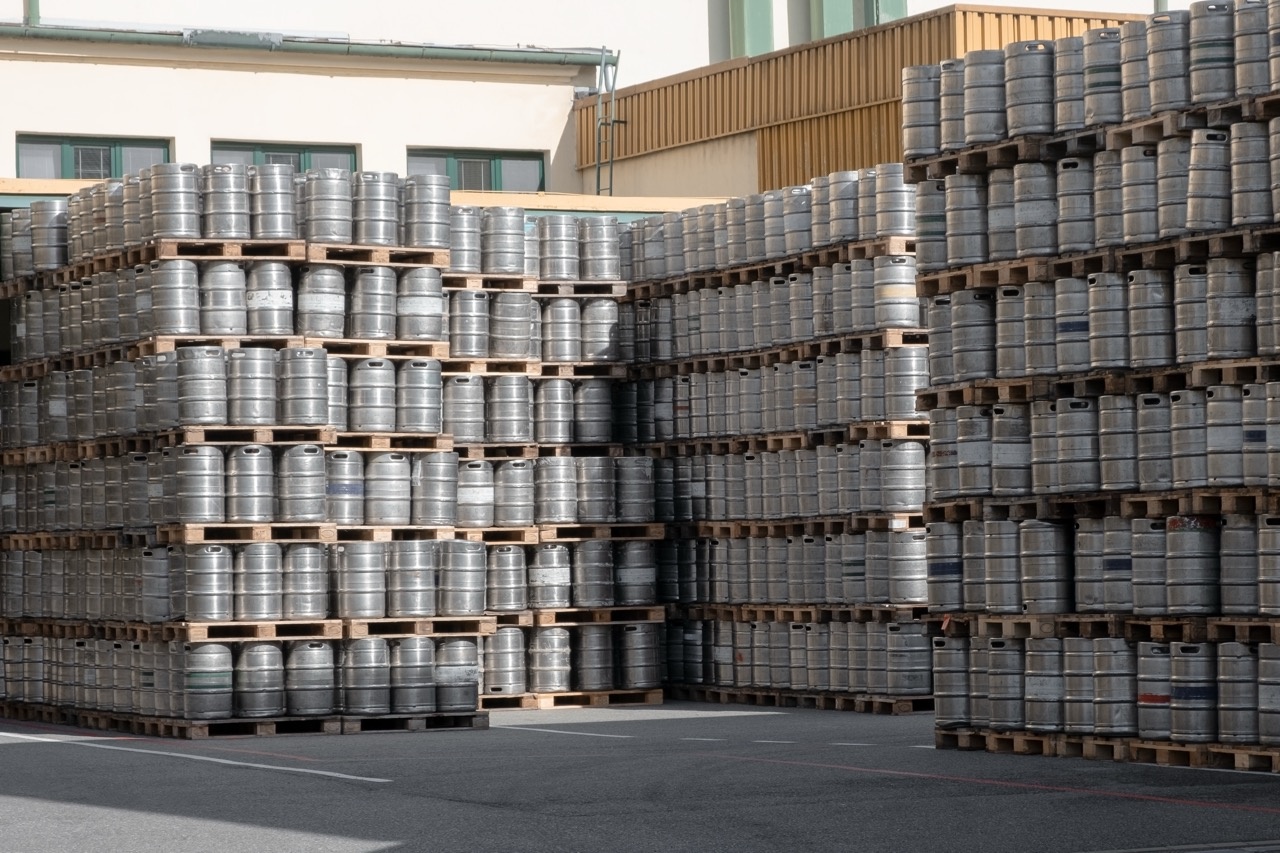 Lots of Beer Kegs Stacked with Pallettes